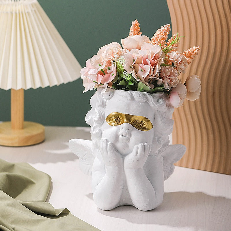 Cute little angel home decoration with gold cheeks and flower pots