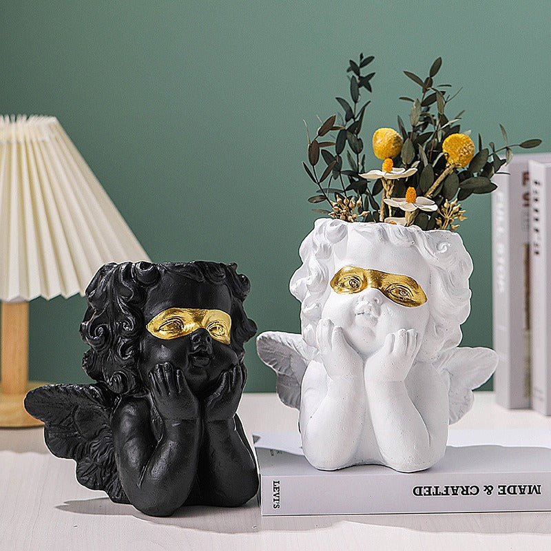Cute little angel home decoration with gold cheeks and flower pots