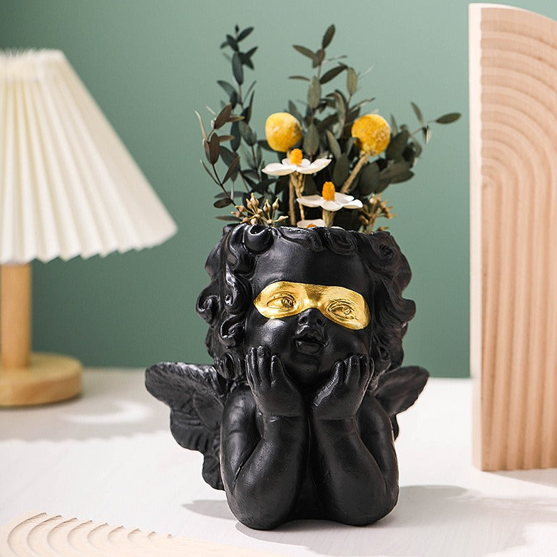 Cute little angel home decoration with gold cheeks and flower pots