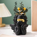 Cute little angel home decoration with gold cheeks and flower pots